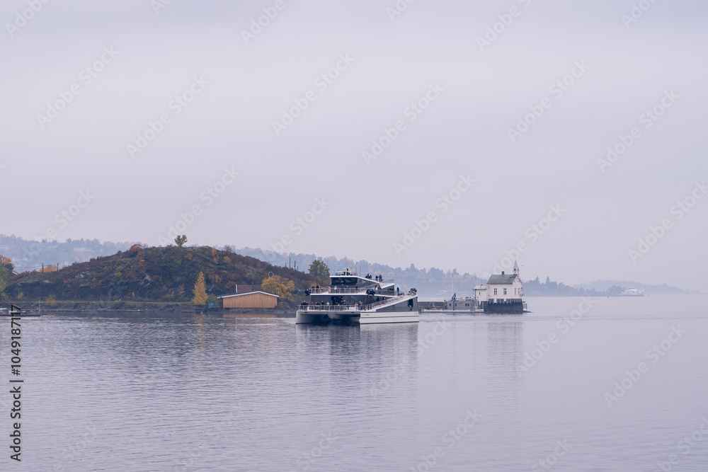 Oslo, Norway - October 19, 2024 – Island Ferries Cruising Oslofjord. Oslo, Norway - October 19, 2024 – Island Ferries Cruising Oslofjord.
