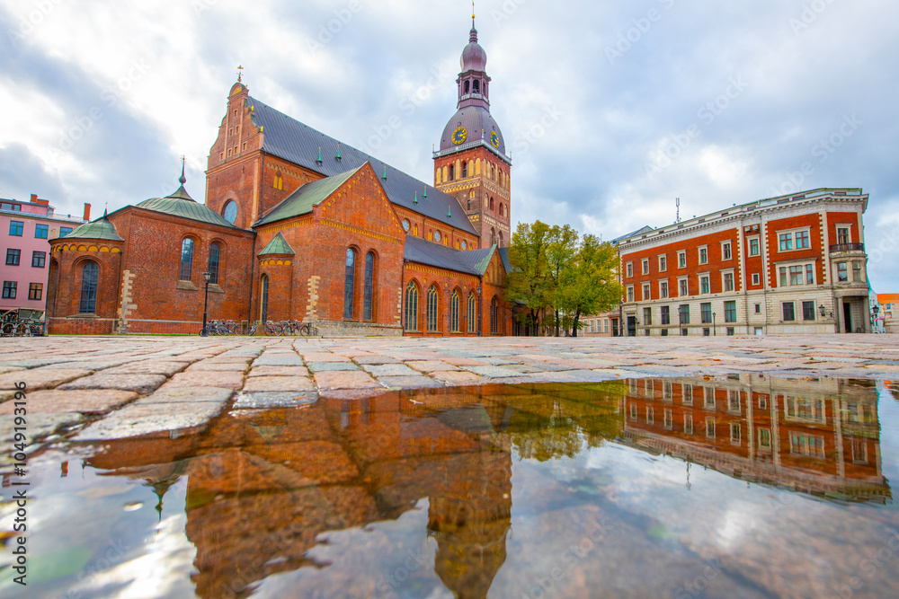 Obraz premium Old street in old Riga. The city is capital of Latvia that is well known to be a very popular tourism destination in the Baltic region