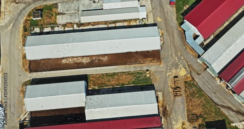 Large Farming Fascility In Small Rural Area Village High Altitude Aerial Shot Top Down photo