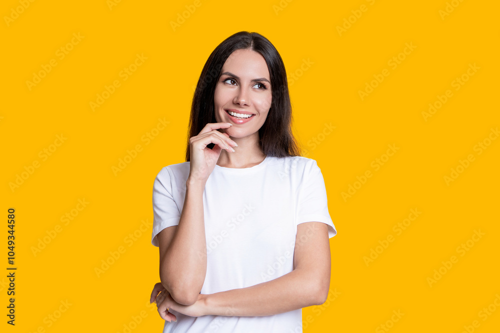 Dreamy young woman with brunette hair. Stylish female. Female casual style. Portrait of millennial girl. Caucasian millennial girl. Woman in white tshirt isolated on yellow. Capturing personality Dreamy young woman with brunette hair. Stylish female. Female casual style. Portrait of millennial girl. Caucasian millennial girl. Woman in white tshirt isolated on yellow. Capturing personality