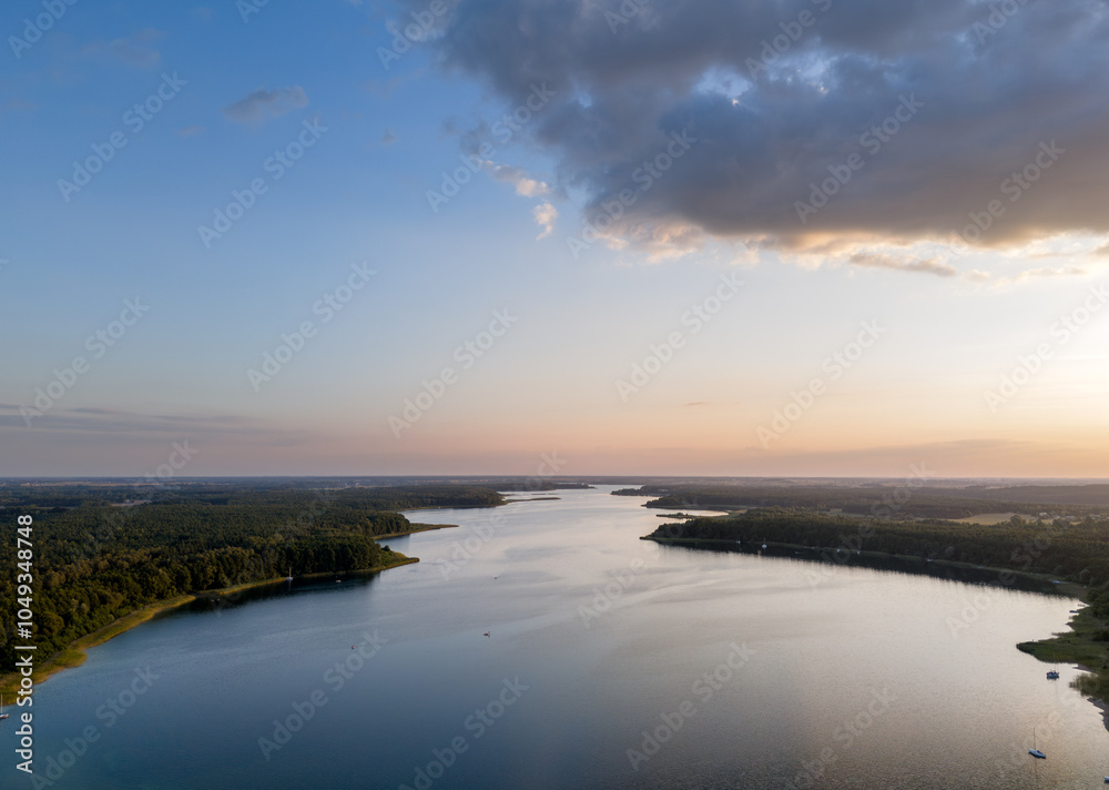 Aerial landscape skyline view of Powidz lake and Anastazewo beach (Jezioro Powidzkie, Plaża Anastazewo) at sunset. Popular summer resort in Wielkopolska, Poland