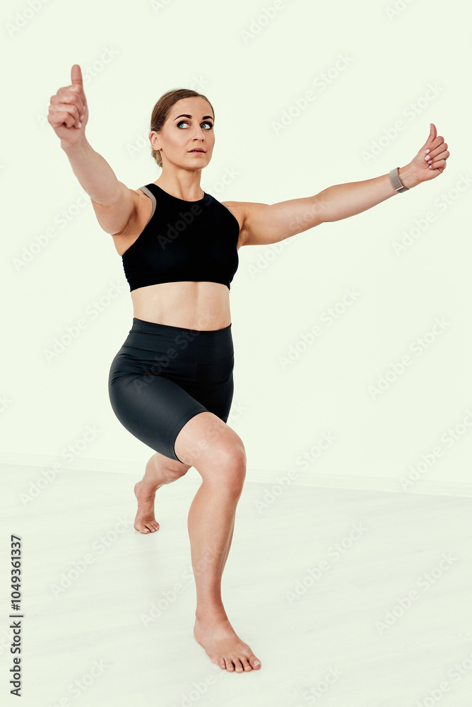 Female Trainer in Lunge Position for Balance Training. Female Trainer in Lunge Position for Balance Training.