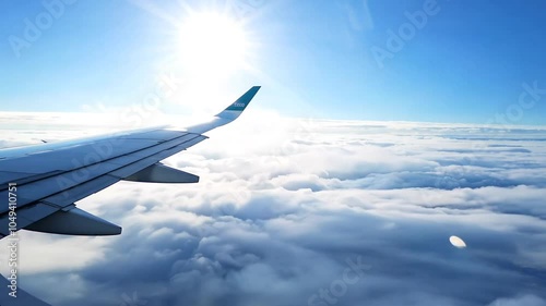 Clouds Airplane Wing Pierces plane window view cloud flying travel air cover white blue skies journey adventure exploration turbulence lift aerodynamic take-off landing boarding departure arrival aer