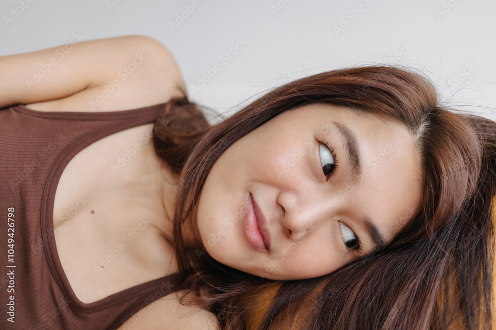 Close up of happy asian woman selfie herself enjoy relaxing on sofa and pillow. Close up of happy asian woman selfie herself enjoy relaxing on sofa and pillow.