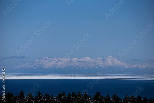 snow mountain over the sea