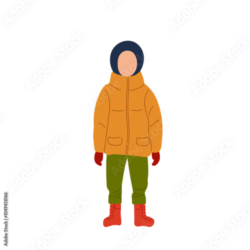 A person dressed warmly in winter attire standing outdoors during a cold day in a snowy landscape