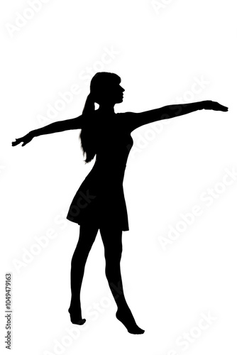 A silhouette of a woman standing with arms outstretched gracefully