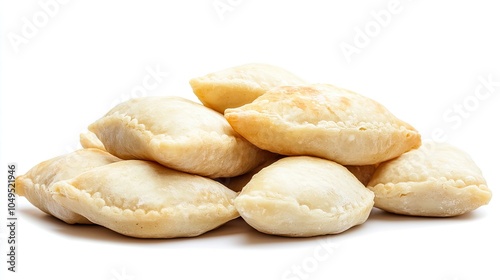 Traditional Ukrainian vareniki dumplings, ready to be served, isolated on a white background