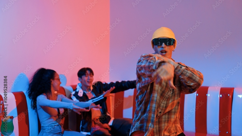 Caucasian break dancer perform movement while diverse friend sitting and dancing together. Happy hipster moving hand while multicultural group waving hand to support and encourage friend. Regalement. Caucasian break dancer perform movement while diverse friend sitting and dancing together. Happy hipster moving hand while multicultural group waving hand to support and encourage friend. Regalement.