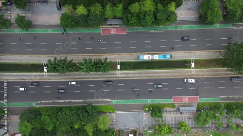 4K Drone View of Urban Street Transportation. Experience the bustling activity of urban street transportation captured from a unique aerial perspective. This high-definition drone footage showcases