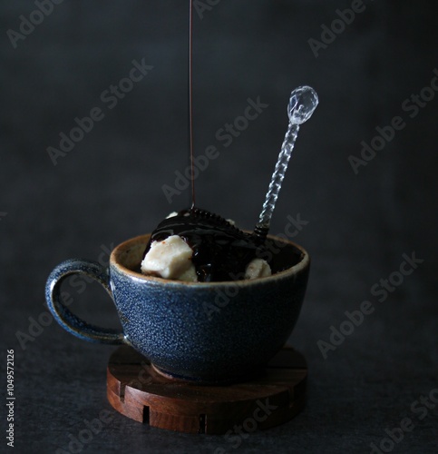 Blue cup filled with ice cream photo