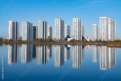 View of the multi-story residential complex on a sunny October morning photo