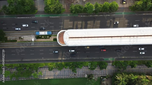 Aerial Drone Footage of City Street Traffic. Immerse yourself in the vibrant energy of city streets with this stunning aerial drone footage. The video captures the seamless movement of cars, buses.
