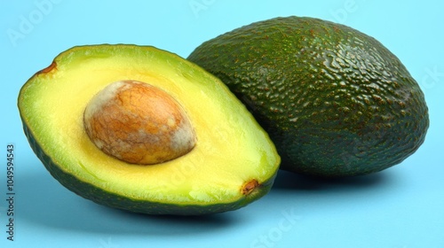 Ripe Avocado Halved on Blue Background