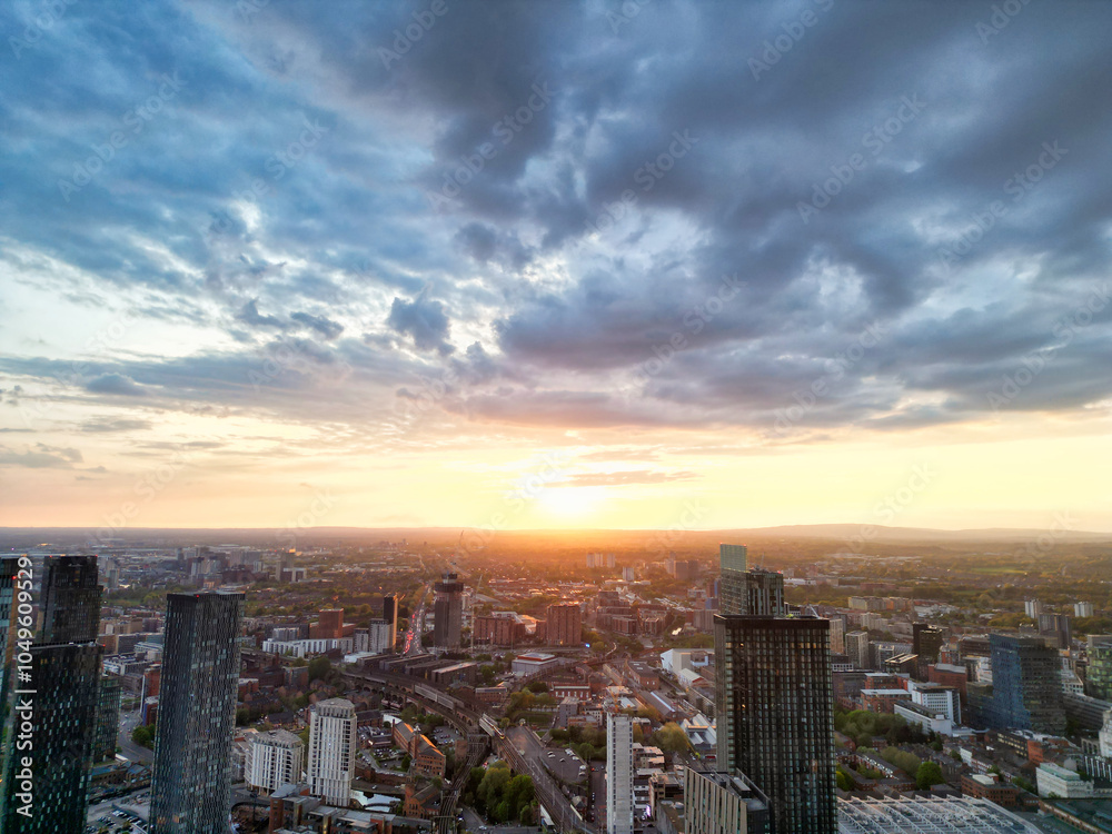Obraz premium Aerial View of Greater Manchester City Centre and Tall Buildings During Golden Hour of Sunset, England UK. High Angle View Was Captured with Drone's Camera on the day of May 5th, 2024