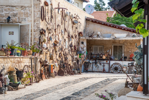 Courtyard decorated with antique household and the agricultural utensils in Zikhron Yaakov city in northern Israel photo