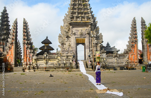 Balinese Woman at Temple Entrance photo