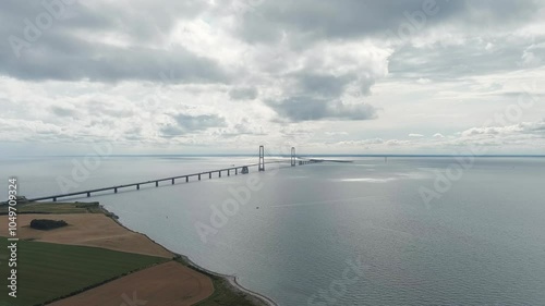 Korser, Denmark. Great Belt Bridge (Storeb?lt). Cloudy weather with gaps, Aerial View, Departure of the camera photo