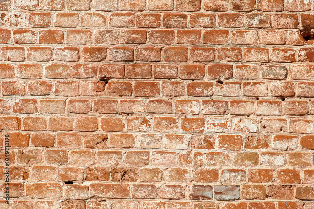 Fototapeta premium A brick wall with a white spot on it