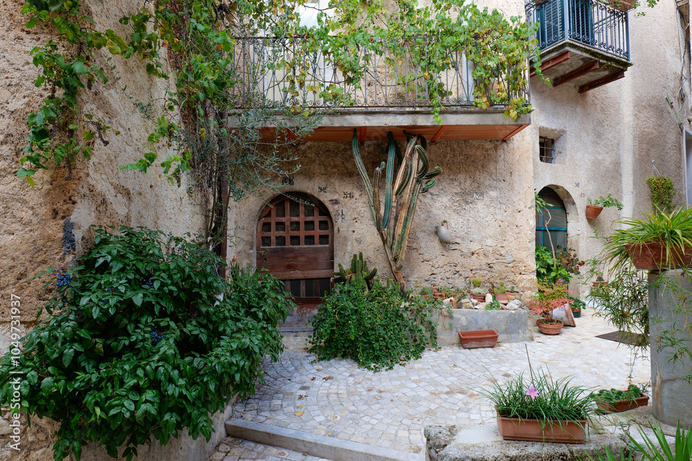 Fototapeta premium A street between the old houses of Alvito in Lazio, Italy. 