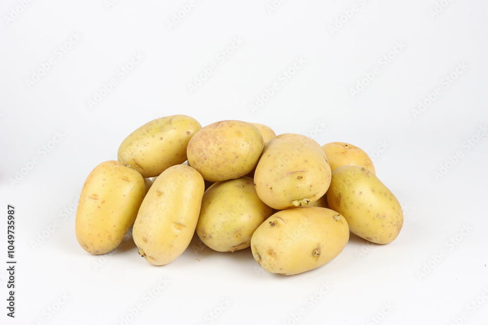 Group of raw unpeeled potatoes on a white background, horizontal image Group of raw unpeeled potatoes on a white background, horizontal image