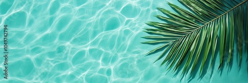 Tropical Palm Leaf on Vibrant Turquoise Water, Summer Vacation Concept