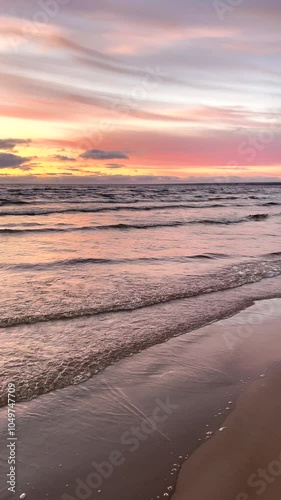 The water, the sea glistens in the sun. Sunset, sunrise on the seashore. Defocusing the light. Abstract, natural background. Ripples run through the water. Water surface. 