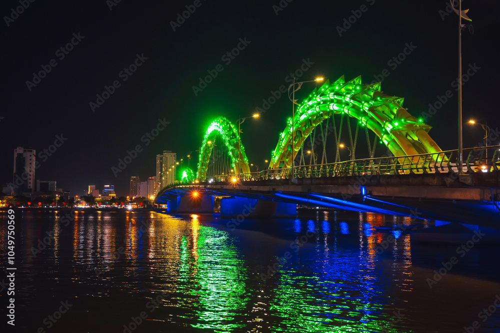 Obraz premium Dragon Bridge or Cau Rong Bridge over Han River is a famous landmark in the city of Da Nang in Vietnam at night