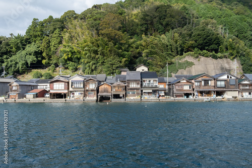 Ine Fishing Village, is famous for its unique funaya, or boat houses. These wooden buildings sit right on the water and serve as both dock and home for the fishermen photo