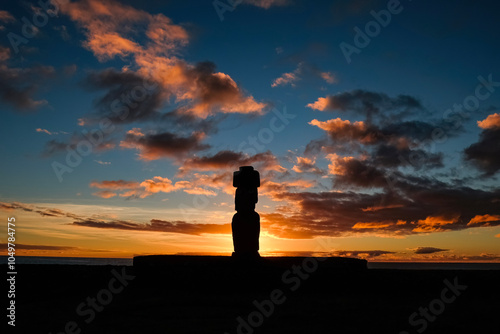 Silhouette of Moai statue at sunset