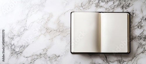 Blank sketchbook on a marbl...