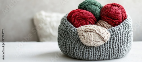 Green and red yarn in a gra...