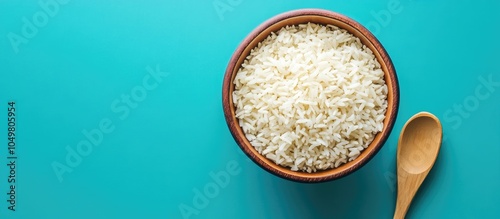 Bowl of rice and a wooden s...