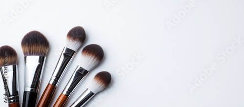 Makeup brushes on a white b...