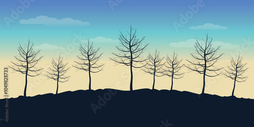 Background with black silhouettes of lonely trees without leaves growing on a hill against blue sky with clouds and sunrise