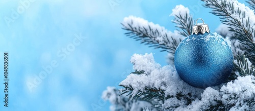 A shiny blue ball on a snow...