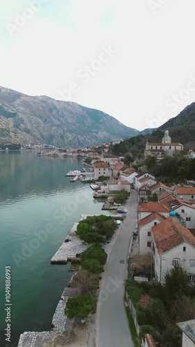 Vacation and travel concept. Kotor Boka Bay, winter aerial view from drone. Vertical shot