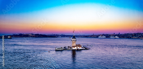 Maiden's Tower with beautiful sunrise sky in Istanbul, Turkey. (Turkish Name: Kiz Kulesi). Colorful sunrise sky in Istanbul. Drone shot.