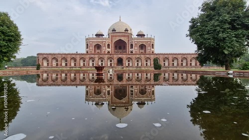 Delhi- 2024, Jul 9: Timelapse of tourists and foam in the pool at Humayun's Tomb photo