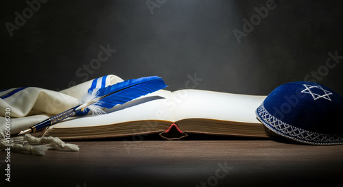 Open book with a pen and kippah on a table displaying cultural symbols and religious text in a serene setting photo