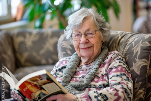 Senior old lady sitting in living room with a book. Timespending of elderly retired people concept photo