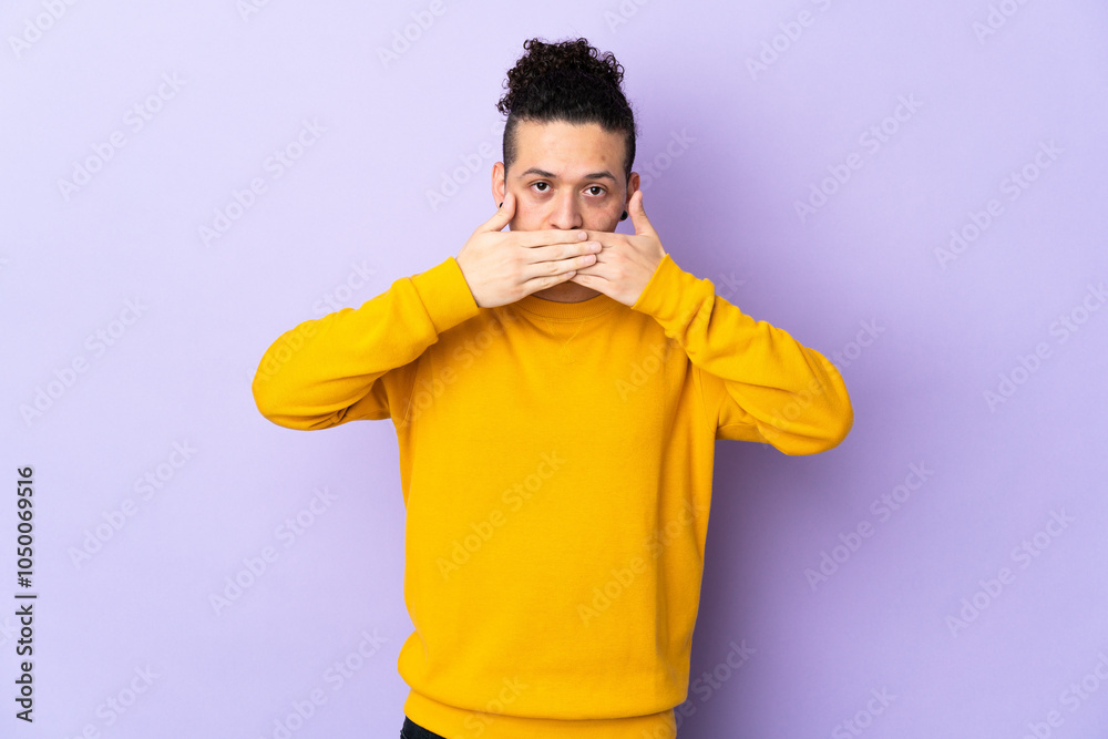 Caucasian man over isolated background covering mouth with hands Caucasian man over isolated background covering mouth with hands