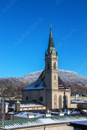 SALZBURG, AUSTRIA - 01.13.2024: Salzburg Cathedral and Franciscan Church on a winter sunny day. photo