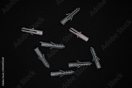 Plastic pegs isolated on black background