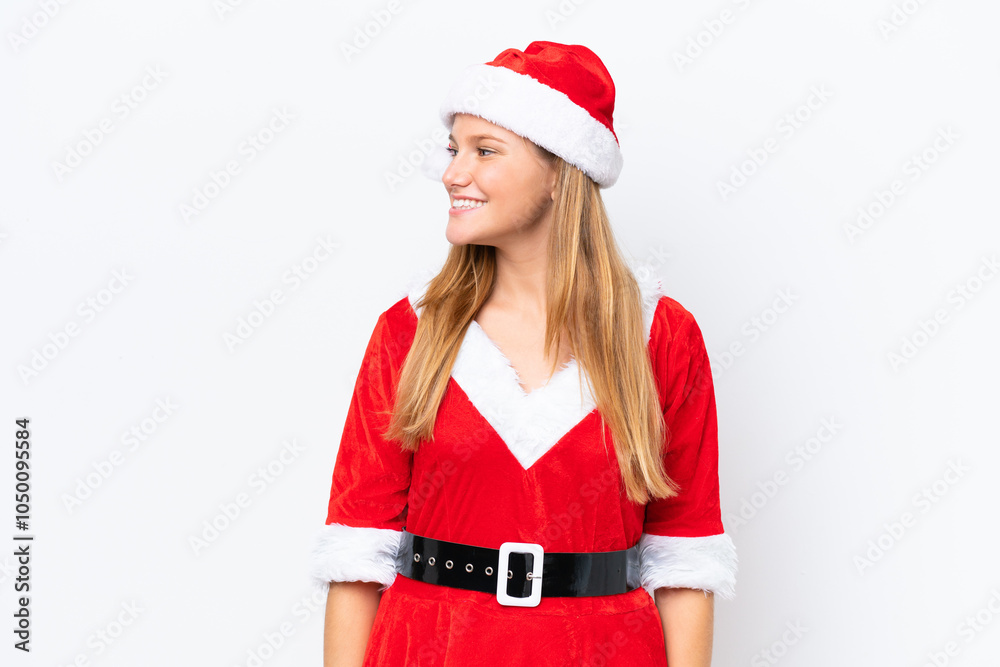 Young caucasian woman dressed as mama noel isolated on white background looking side Young caucasian woman dressed as mama noel isolated on white background looking side