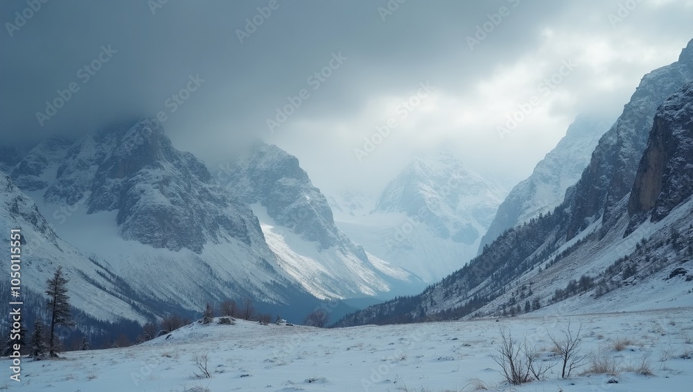 Snowy mountain peaks under brooding sky evoking cold beautiful melancholy Snowy mountain peaks under brooding sky evoking cold beautiful melancholy