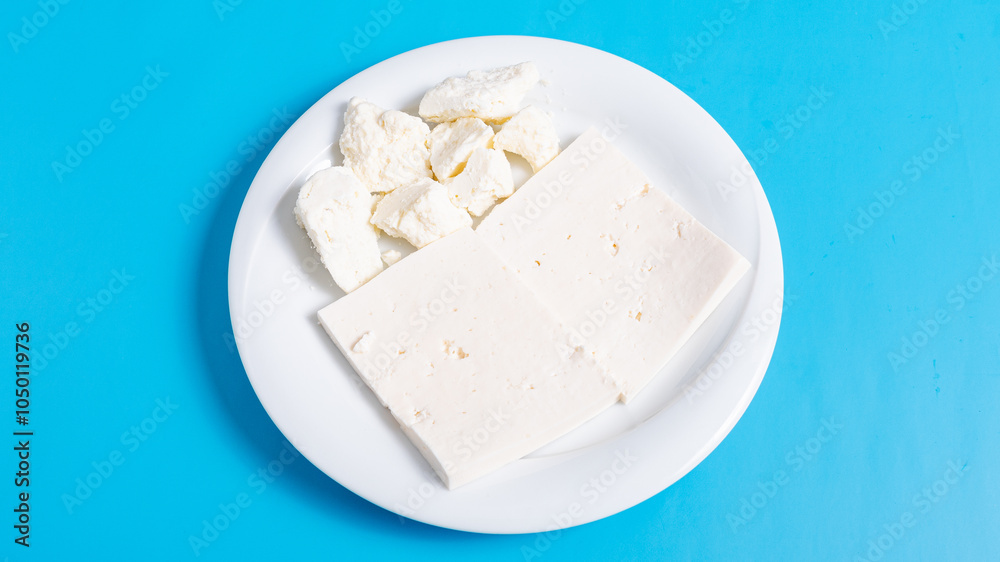 Sliced white cheese on plate Sliced white cheese on plate