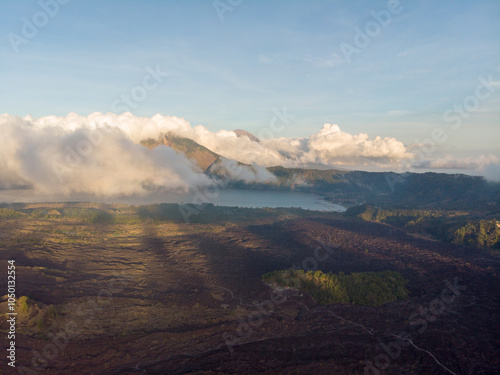 A breathtaking view of a scenic mountain landscape with clouds rolling over a tranquil lake. photo