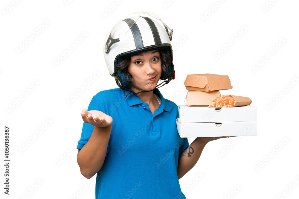 Young Argentinian deliver fast food over isolated background making doubts gesture while lifting the shoulders Young Argentinian deliver fast food over isolated background making doubts gesture while lifting the shoulders