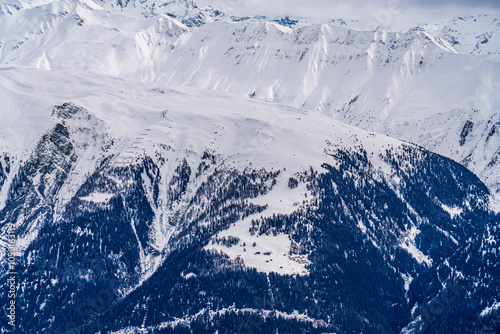 View on winter mpuntains from Eggishorn peak, Alps. photo